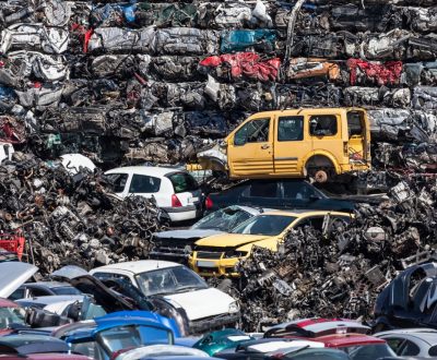 car scrapes in field for recycling